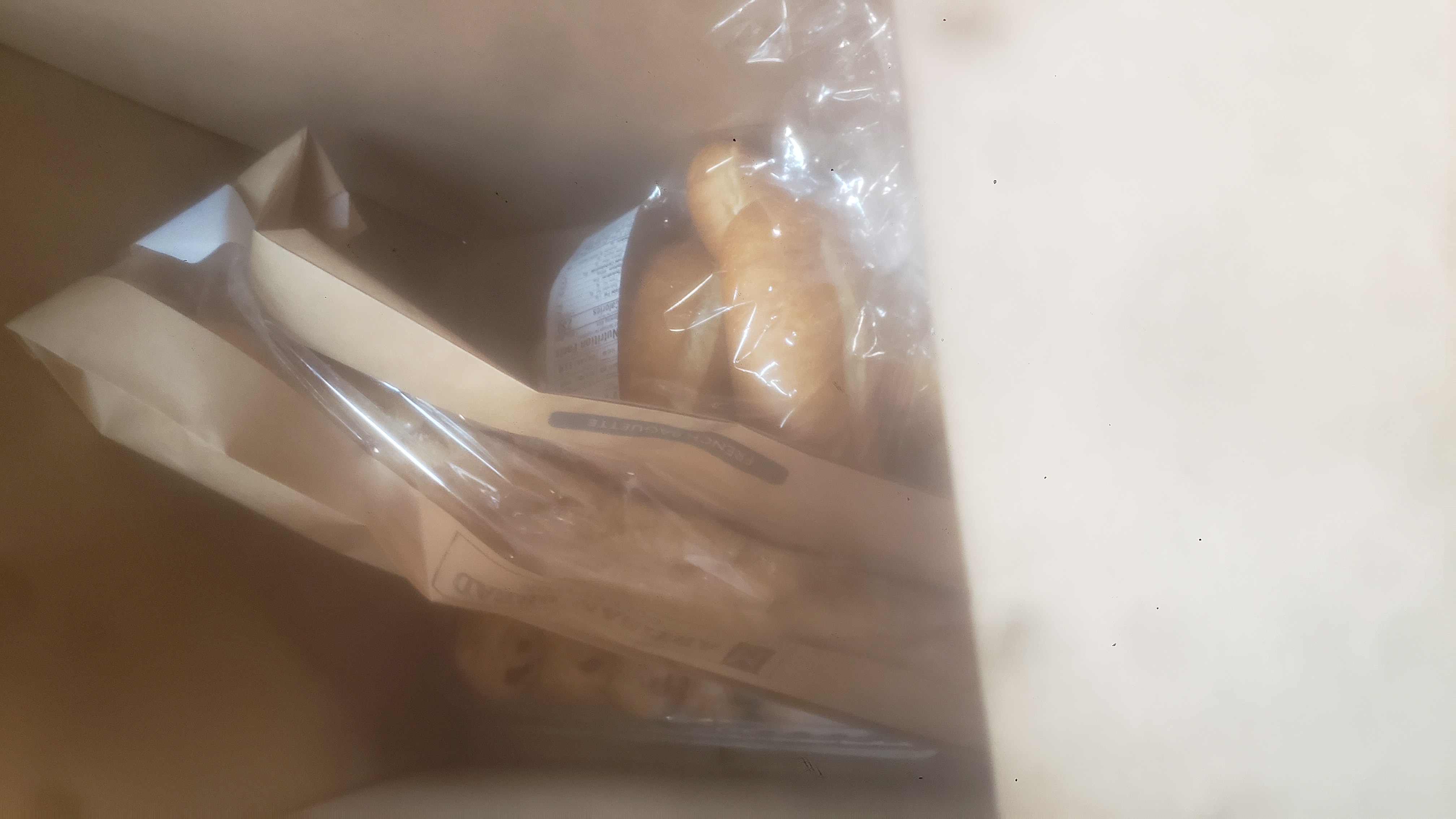 Assorted pastries in a cardboard box.